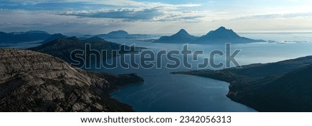 Panorama of Tomma mountain island in Norwegian archipelago coastline of Helgeland. Smaltinden view, Luröy, Nordnorge. Norway mountains in the summer. High resolution beautiful Norway. Fjelltur Norge