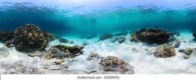 Panorama of a tropical reef with rocks on a sandy bottom. Racha Yai island, Thailand
