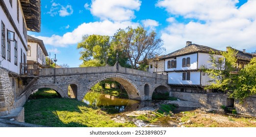 Panorama of Tryavna, Bulgaria. The old Stone Arch Bridge in the old town in the architectural traditional complex. Region of Gabrovo. National revival Bulgarian architecture. - Powered by Shutterstock