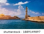 Panorama of venetian harbour waterfront and lighthouse in old harbour of Chania, Crete, Greece. Old venetian lighthouse in Chania, Greece. Lighthouse of the old Venetian port in Chania, Greece.