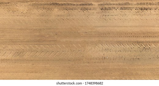 Panorama View From Above On Texture Of Gravel Road With Car Tire Tracks