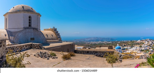 A Panorama View Across The Castle Ruins In Pyrgos, Santorini In Summertime