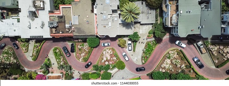 Panorama view aerial Lombard Street, an east–west street in San Francisco, California. Famous for steep, one-block section with eight hairpin turns. Crookedest, steep hills, sharp curves, one-way road