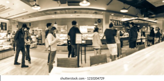 Panorama View Asian Bakery Shop In Texas, USA. Defocused Multiethnic People Waiting In Line To Check-out Fresh Baked Bread In Pastry Shop Counter.