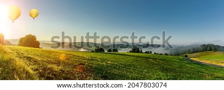 Panorama view of Bavarian Forest from Perlesreut with hot air balloon