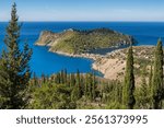 Panorama view of beautiful and picturesque colorful traditional fishing village of Assos on Cefalonia island, Ionian sea, Greece. Peninsula of Assos in Kefalonia, Greece