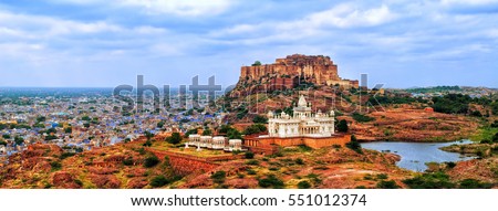 Panorama view of the blue city of Jodhpur, Rajasthan, India, with Mehrangharh Fort and Jaswant Thada mausoleum