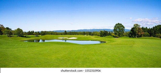 Panorama View of Golf Course with beautiful green field. Golf course with a rich green turf beautiful scenery.