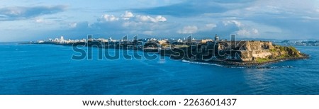 A panorama view of the harbour entrance fortifications and coastline in San Juan, Puerto Rico on a bright sunny day