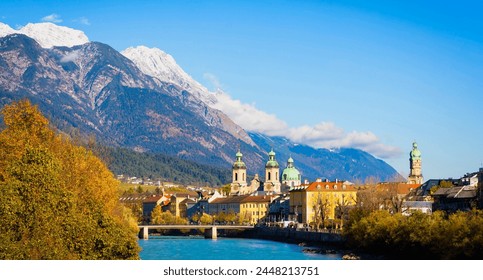 Panorama view of  Innsbruck  as city center town with beautiful houses, river Inn and Tyrol Alps, Austria - Powered by Shutterstock