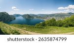 Panorama view of lake Lugano in Ticino Switzerland shot from top of Monte Bre, looking out towards mount San Salvatore
