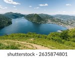 Panorama view of lake Lugano in Ticino Switzerland shot from top of Monte Bre, looking out towards mount San Salvatore
