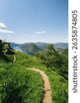 Panorama view of lake Lugano in Ticino Switzerland shot from top of Monte Bre, looking out towards mount San Salvatore