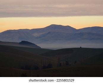 Panorama view of mountain range with low hanging clouds along Highway 79 between Fairline and Geraldine Timaru Canterbury South Island New Zealand