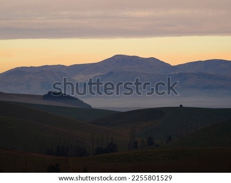 Panorama view of mountain range with low hanging clouds along Highway 79 between Fairline and Geraldine Timaru Canterbury South Island New Zealand