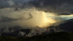 Panorama View Of Mountain With Storm Clouds And Rain Storm Before Sunset