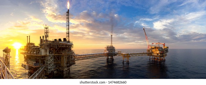 Panorama view of offshore oil and Gas processing platform in sunset time, Concept of exploration and petroleum production industry in the sea. - Shutterstock ID 1474682660