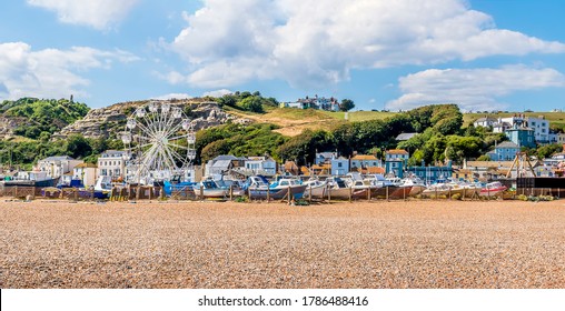 A Panorama View Of The Old Town Beach In Hastings, Sussex With The West Cliff Backdrop In Summer