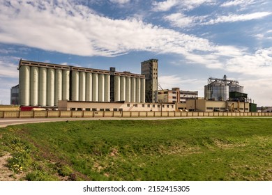 panorama view on agro silos granary elevator on agro-processing manufacturing plant for processing drying cleaning and storage of agricultural products, flour, cereals and grain. 
