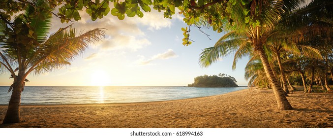 Panorama view on beautiful sunset and tropical beach