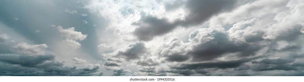 Panorama view of overcast sky. Dramatic gray sky and white clouds before rain in rainy season. Cloudy and moody sky. Storm sky. Cloudscape. Gloomy and moody background. Overcast clouds. - Shutterstock ID 1994333516