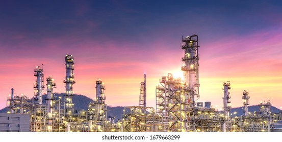 Panorama view of petrochemical oil and gas refinery and pipeline industry with sunset sky background