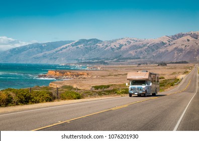 Panorama view of recreational vehicle driving on famous Highway 1 along the beautiful Central Coast of California, Big Sur, USA