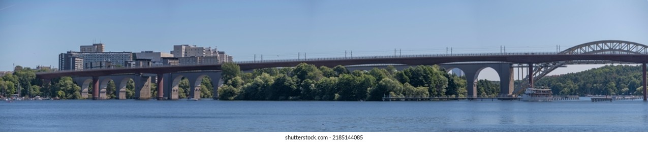 Panorama View Of Two Long Train Bridges, Canal Boat Diana Passing For The Town Göteborg A Sunny Summer Day In Stockholm, Sweden 2022-07-31