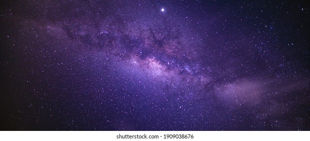 Panorama view universe space shot of milky way galaxy with stars on a night sky background. The Milky Way is the galaxy that contains our Solar System. - Shutterstock ID 1909038676
