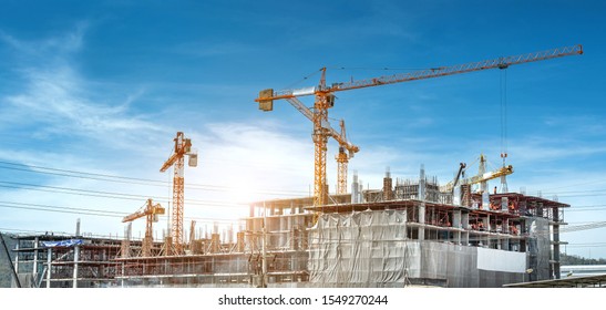 Panorama view at workers are working large construction sites   many cranes are working in the  Industry new building business 
