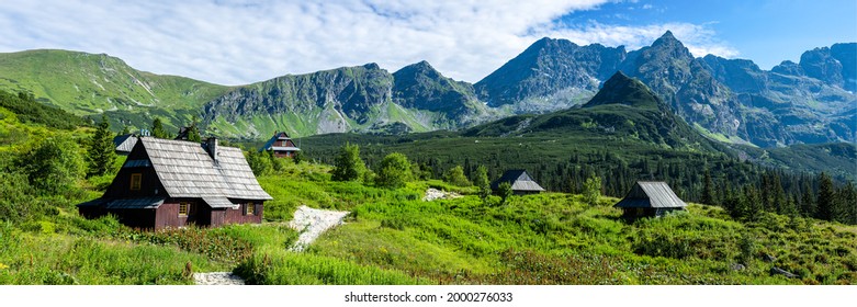 Panorama of a village in mountains. Hill house path in nature - Shutterstock ID 2000276033