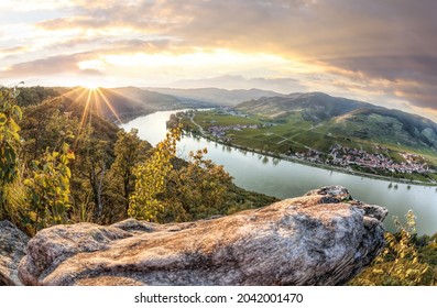 Panorama of Wachau valley (Unesco world heritage site) with Danube river at colorful sunset against Duernstein village in Lower Austria, Austria