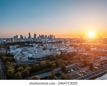 panorama of Warsaw city skyline at sunset, skyscrapers of downtown and green park, aerial top view - Powered by Shutterstock