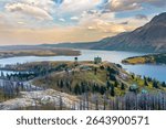 Panorama of Waterton townsite at dusk in autumn after a wildfire. Landscape scenery with fall foliage. Waterton Lakes National Park, Alberta, Canada.