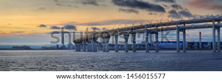 Panorama of the Western high-Speed Diameter of St. Petersburg on the background of the Gulf of Finland and late sunset