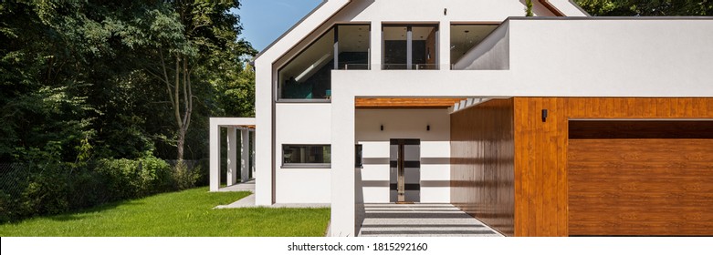 Panorama Of White Modern And Beautiful House With Garage In Forest