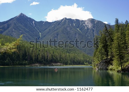 panorama of the whiteswan lake with a canoe - Located in the Kootenay Range of the Rocky Mountains, BC, Canada
