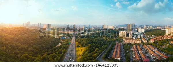 Panorama wide angle\
view cityscape,green park,terrace house and highway located at\
Kuala Lumpur,Malaysia\
.