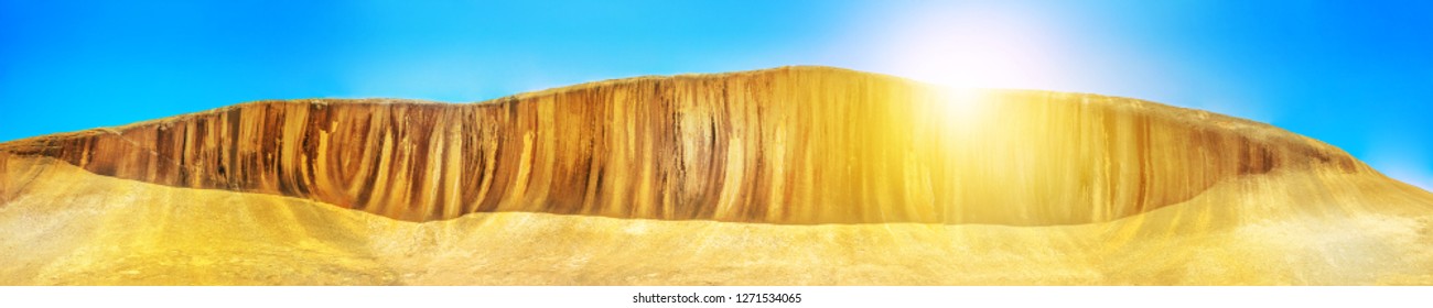 Panorama Wide View Of Wave Rock An Ocean Wave Shaped Rock At Sunset Light, Located In Hyden Wildlife Park, Western Australia. Famous Landmark In Australian Outback. Front View.