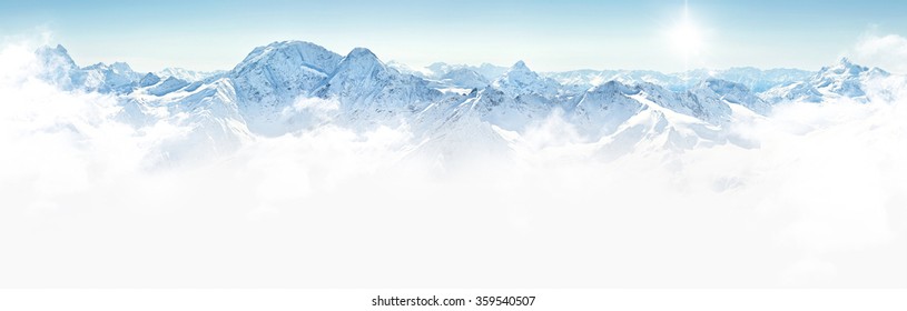 Panorama Of Winter Mountains With Clouds, Bright Sun And Copy Space