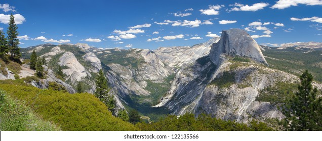 A panorama of Yosemite Valley with Half Dome in the Distance.