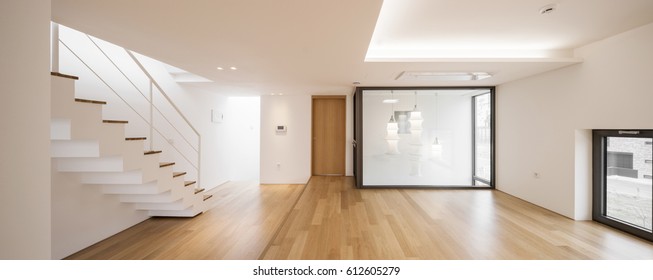 panorama(wide angle) for interior, living room with wood floor, white wall, stair, door, lighting. 