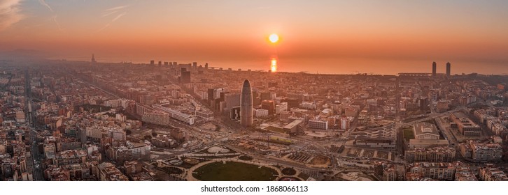 Panoramic Aerial Drone Shot Of Rising Sun Over Barcelona City Beach