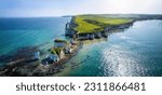Panoramic aerial landscape view of the Old Harry Rocks headland, Dorset, England, during a sunny spring day