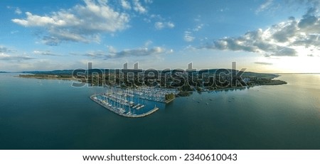 Panoramic aerial view about the pier of Alsoors town in lake Balaton in Hungary. This place is a part of the north coast of the Hungarian sea. There are many luxury yacht in the harbor.