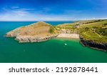 Panoramic aerial view of a beautiful sandy beach and headland (Mwnt, Ceredigion, West Wales)
