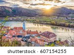 Panoramic aerial view of beautiful Wachau Valley with the historic town of Durnstein and famous Danube river in beautiful golden evening light at sunset, Lower Austria region, Austria