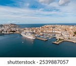 Panoramic aerial view of A Coruña City. View of Harbour and Old town center. Famous travel destination in Galicia, North-west of Spain. Large cruise ship docked in the port. Cloudy day. 