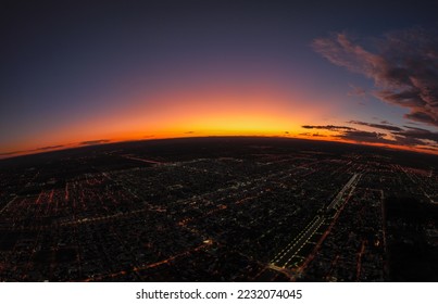 Panoramic aerial view of city landscape at dusk with dramatic sky. General Roca, Rio Negro, Argentina - Shutterstock ID 2232074045
