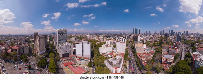 Panoramic aerial view of the city of mexico over the famous colonies of Rome and Countess, near Insurgentes Avenue on a beautiful sunny day - Shutterstock ID 1384459448